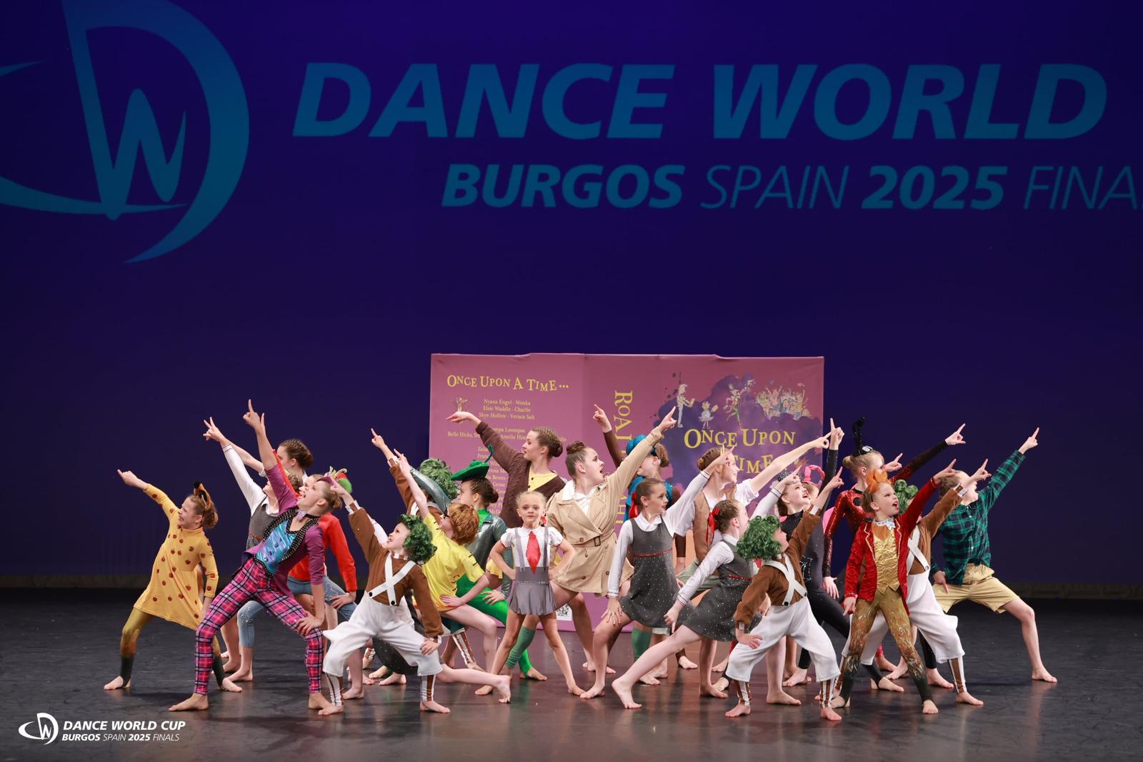 Moondance musical theatre group in character costumes on stage